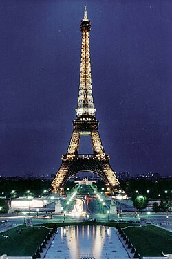 The Eiffel Tower in a night sky.